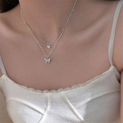 Elegantes zweiteiliges Silberhalsketten-Set mit Schmetterlingsanhänger – Symbol für Transformation und Freude